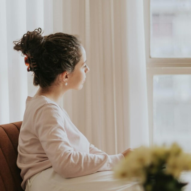 Woman looking out the window